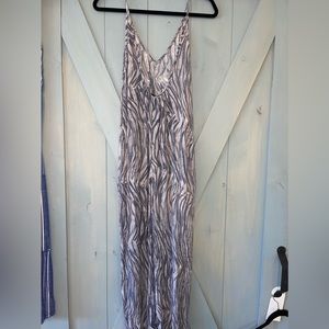 Beautiful romper, made in America,very flattering has pockets!